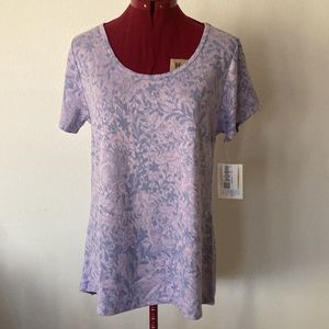 The LuLaRoe Classic T light purple Blouse Size Medium. Round neck short sleeves